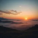 Sunrise Over Misty Hills