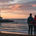 Distant Lighthouse Shoreline Two Figures Symbolic