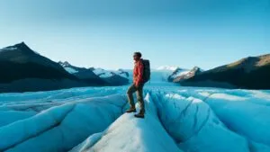 Hiker Standing on Blue Glacier Edge