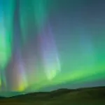 Northern Lights Over Hills