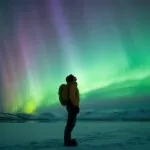 Traveler Gazing Up at the Northern Lights