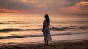 Woman Gazing at the Horizon by the Beach