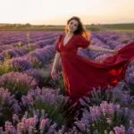 Woman in a Flowing Red Dress in a Lavender Field