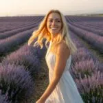 Woman Walking Through Blooming Lavender Fields