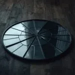 Broken Mirror on Wooden Floor
