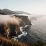 Coastal Fog Rolling Over Cliffs Ocean View Mysterious