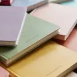Colorful Notebooks Arranged in Pastel Palette