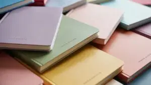 Colorful Notebooks Arranged in Pastel Palette