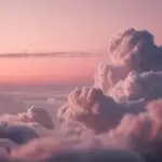 Cotton Clouds Over Soft Pink Horizon