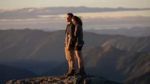 Couple Standing on Mountain Ridge
