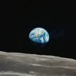 Earth Rising Above Lunar Surface