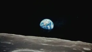 Earth Rising Above Lunar Surface