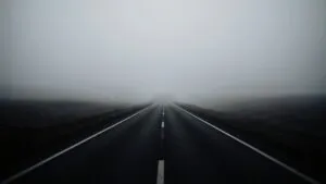 Empty Road Through the Fog