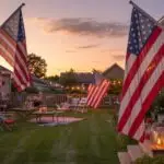 Fourth of July Flags and Sunset Backyard Scene