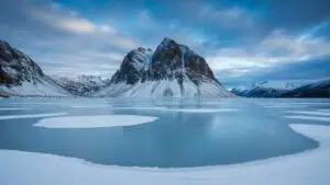 Frozen Lake Snowy Mountain Serene Winter Beauty