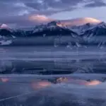 Frozen Lake With Distant Mountains