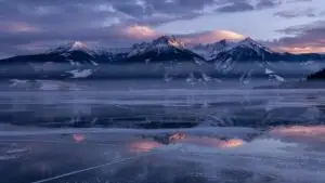 Frozen Lake With Distant Mountains