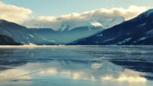Frozen Lake With Snowy Mountain