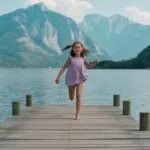 Girl Running on Wooden Dock