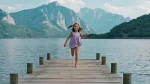 Girl Running on Wooden Dock
