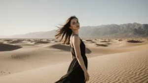 Girl Standing on Desert Dunes