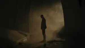 Man Standing in Dim Tunnel