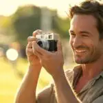 Man Taking Photos With a Vintage Camera