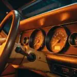 Old Car Dashboard With Orange Vintage Lights