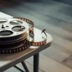 Old Film Reel on Metal Table With Soft Shadows