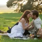 Picnic Moment With Couple in Green Field