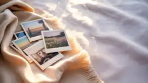 Polaroid Photos Scattered on Soft Blanket