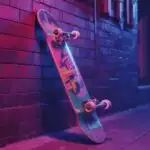 Retro Skateboard Leaning Against Brick Wall
