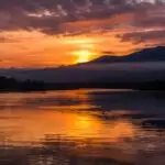 Scenic View Calm Water Vibrant Orange Sunset