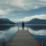 Traveler Standing on Wooden Pier