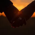 Two Hands Intertwined Rings Engagement Symbol Gold