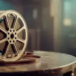 Vintage Cinema Reel Resting on Worn Metal Surface