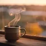Warm Steam Rising From Coffee Mug at Dawn