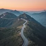 Winding Road Through Mountains Aerial View
