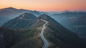 Winding Road Through Mountains Aerial View