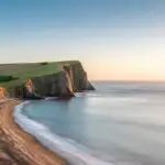 Beach Cliffs Under Bright Blue Sky