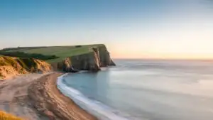 Beach Cliffs Under Bright Blue Sky