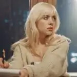 Billie Eilish Writing Lyrics Beside a Window
