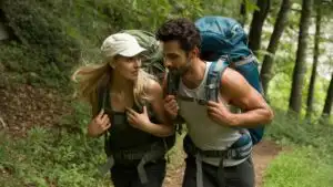 Couple Hiking Together on a Forest Trail