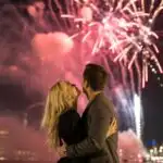 Couple Hugging Under Fireworks