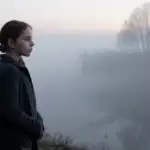 Girl Standing in Cold Foggy Morning