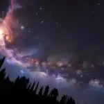 Glowing Nebula Behind Silhouette Trees