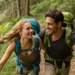 Happy Hiking Couple Walking Through the Forest