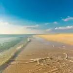 Idyllic Coastal View with Warm Sand