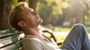 Man Resting on Park Bench Looking at the Sky