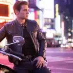 Man Waiting Beside Motorcycle at Night Lights